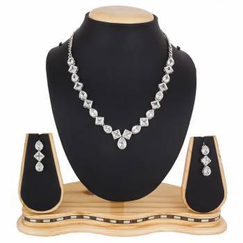 Give A Rich And Elegant Look To Your Neckline With This Designer Necklace Set In Silver Color Beautified With Attractive Stone Work, You Can Pair This Up With Any Colored Indian Or Western Attire. 