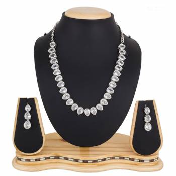 Give A Rich And Elegant Look To Your Neckline With This Designer Necklace Set In Silver Color Beautified With Attractive Stone Work, You Can Pair This Up With Any Colored Indian Or Western Attire. 