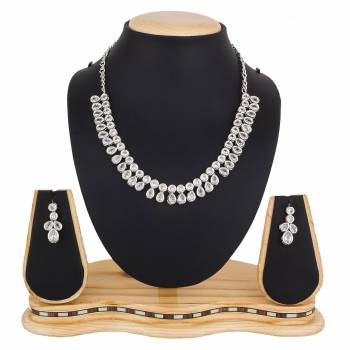 Give A Rich And Elegant Look To Your Neckline With This Designer Necklace Set In Silver Color Beautified With Attractive Stone Work, You Can Pair This Up With Any Colored Indian Or Western Attire. 