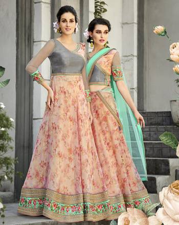 Here Is A Designer Lehenga Choli For The Upcoming Festive And Wedding Season. This Designer Lehenga Choli Can Be Stitched As A Floor Length Suit As Per Your Occasion. Its Blouse Is Fabricated On Art Silk And Net Paired With Oragenza Fabricated Floral Printed Lehenga And Net Fabricated Dupatta. Buy This Now.