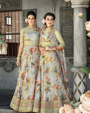 Here Is A Designer Lehenga Choli For The Upcoming Festive And Wedding Season. This Designer Lehenga Choli Can Be Stitched As A Floor Length Suit As Per Your Occasion. Its Blouse Is Fabricated On Art Silk And Net Paired With Oragenza Fabricated Floral Printed Lehenga And Net Fabricated Dupatta. Buy This Now.