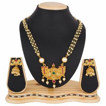 For A Queen Look, Here Is A Designer Royal Looking Necklace Set In Golden Color. This Necklace Set Can Be Paired With Heavy Ethnic Attire For More Enhanced Look. Buy Now