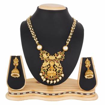 For A Queen Look, Here Is A Designer Royal Looking Necklace Set In Golden Color. This Necklace Set Can Be Paired With Heavy Ethnic Attire For More Enhanced Look. Buy Now