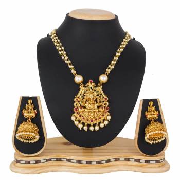 For A Queen Look, Here Is A Designer Royal Looking Necklace Set In Golden Color. This Necklace Set Can Be Paired With Heavy Ethnic Attire For More Enhanced Look. Buy Now