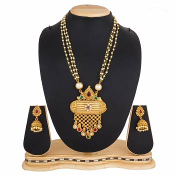 For A Queen Look, Here Is A Designer Royal Looking Necklace Set In Golden Color. This Necklace Set Can Be Paired With Heavy Ethnic Attire For More Enhanced Look. Buy Now