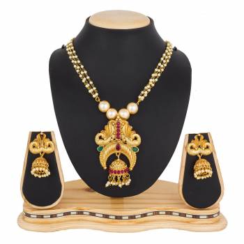 For A Queen Look, Here Is A Designer Royal Looking Necklace Set In Golden Color. This Necklace Set Can Be Paired With Heavy Ethnic Attire For More Enhanced Look. Buy Now