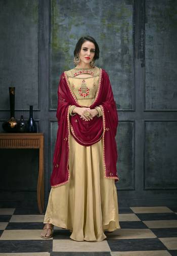 Flaunt Your Rich And Elegant Taste Wearing This Designer Floor Length Suit In Beige Colored Top And Bottom Paired With Maroon Colored Dupatta. Its Top Is Fabricated On Satin Georgette Paired With Santoon Bottom And Chiffon Dupatta. Its Fabrics Ensures Superb Comfort All Day Long. 