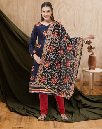 Here Is A Beautiful Embroidered Dress Material In Navy Blue Colored Top and Dupatta Paired With Red Colored Bottom. Its Top And Bottom Are Cotton Based Paired With Chiffon Fabricated Dupatta. Buy Now.