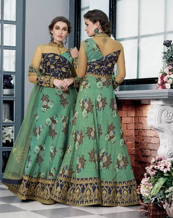 As Per Your Convinince And Occasion, Get This Two-In-One Dress Stitched As Lehenga Or Suit. Its Pretty Blouse Is Fabricated On Art Silk And Net Paired with Modal Silk Fabricated Lehenga And Net Fabricated Dupatta. It Is Beautified With Bold Floral Prints With Embroidery. Also Its Fabrics Ensures Superb Comfort All Day Long. 