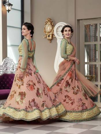 Grab This Designer Two-In-One Lehenga Choli For The Upcoming Festive And Wedding Season. Its Blouse Is Fabricated On Art Silk And Net Paired With Printed Modal Silk And Net Fabricated Dupatta. It Is Beautified With Bold Floral Prints And Attractive Embroidery. Buy Now.