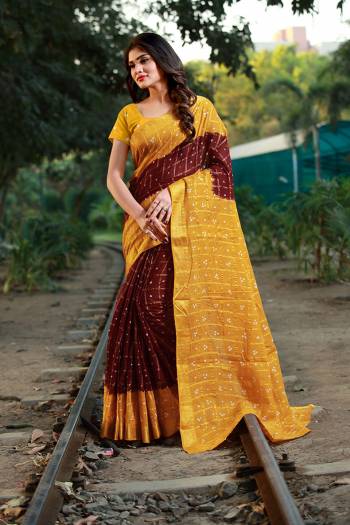 This Festive Season Be The Most Unique Of All Wearing This Handicraft Bandhani Saree. This pretty Saree And Blouse Are Fabricated On Tafeta Art Silk Which Also Gives A Rich Look To Your Personality. 