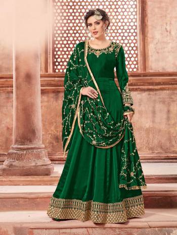 You Will Definitely Earn Lots Of Compliments Weairng This Designer Floor Length Suit In Dark Green Color Paired With Dark Green Colored Bottom And Dupatta. Its Top Is Fabricated On Satin Georgette Paired With Santoon Bottom And Heavy Embroidered Chinon Dupatta. The Main Highlight In This Designer Suit Is Its Embroidered Dupatta. Buy This Semi-Stitched Suit Now.