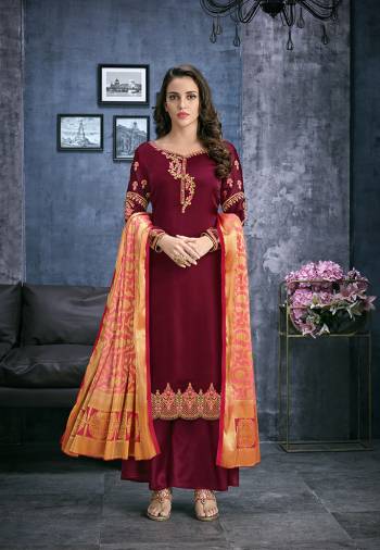 Grab This Designer Straight Suit In Maroon Color Paired With Maroon Colored Bottom And Contrasting Peach Colored Dupatta. Its Top Is Fabricated On Satin Georgette Paired With Santoon Bottom And Jacquard Silk Fabricated Dupatta. Its Top Is Beautified With Attractive Embroidery. Buy Now.