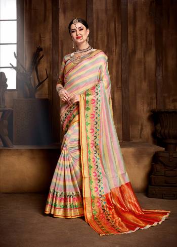 Celebrate This Festive Season With Ease And Comfort Wearing This Saree In Pretty Multi Color Paired With Multi Colored Blouse. This Saree And Blouse Are Fabricated On Banarasi Art Silk Beautified With Weave All Over. 