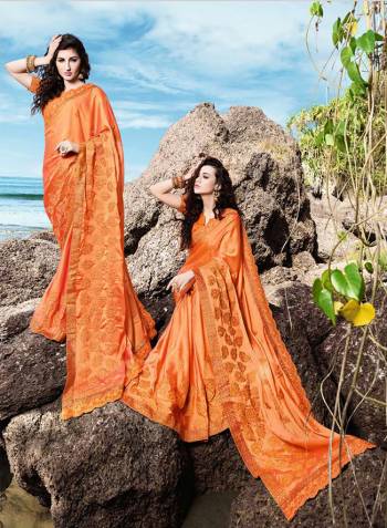 Celebrate This Festive Season Wearing This Designer Saree In Orange Color Paired With Orange Colored Blouse. This Saree Is Fabricated On Georgette Satin Paired With Art Silk Fabricated Blouse. Its Bright Color Will Give An Attractive Look To Your Personality. 