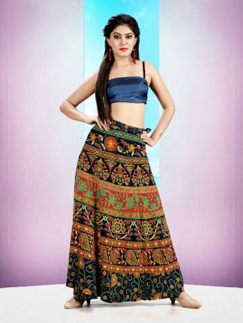 Grab This Beautiful Wrap Around Skirt In Multi Color For Your Casuals Or Semi-Casuals. This Skirt Is Fabricated On Rayon Beautified With Prints All Over.