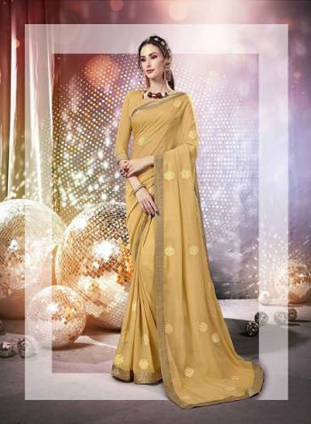 Here Is A Very Pretty Designer Saree Fabricated On Chiffon Paired With Art Silk Fabricated Blouse. It Is Beautified With Tone To Tone Thread Embroidery And Stone Work Which Gives A Rich Look Overall. Buy This Saree Now.