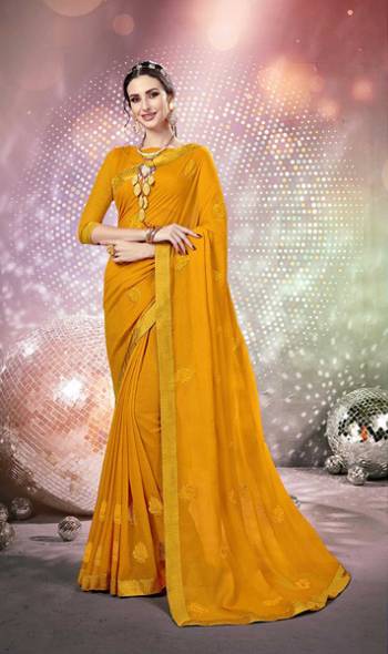 Here Is A Very Pretty Designer Saree Fabricated On Chiffon Paired With Art Silk Fabricated Blouse. It Is Beautified With Tone To Tone Thread Embroidery And Stone Work Which Gives A Rich Look Overall. Buy This Saree Now.