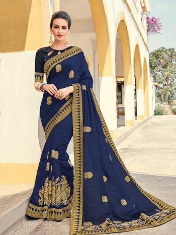 marvelously charming is what you will look at the next wedding gala wearing this beautiful Navy Blue color silk pattern saree. Ideal for party, festive & social gatherings. this gorgeous saree featuring a beautiful mix of designs. Its attractive color and designer heavy embroidered design, Flower embroidered butta design, stone design, beautiful floral design work over the attire & contrast hemline adds to the look. Comes along with a contrast unstitched blouse.