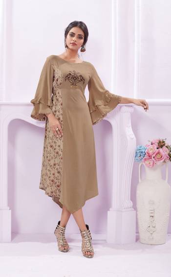 Flaunt Your Rich And Elegant Taste Wearing This Designer Readymade Kurti In Beige Color Fabricated On Rayon. Its Elegant Color And Soft Fabric Makes This Kurti A Perfect Piece. 