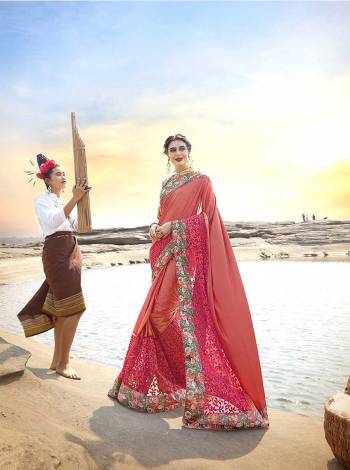 A Must Have Shade In Every Womens Wardrobe Is Here With This Designer Saree In Pink Color Paired With Multi Colored Blouse. This Saree Is Lycra Based Paired With Art Silk Fabricated Blouse. 