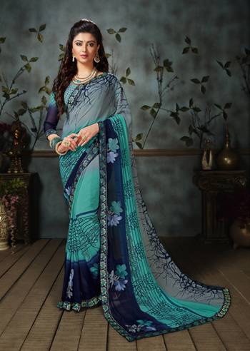 Grab This Beautiful Saree For The Summers. This Saree And Blouse are Georgette Based Beautified With Prints All Over. This Weightless Fabric Is Easy To carry All Day Long. 