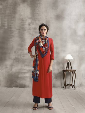 Celebrate This Festive Season Wearing Designer Readymade Plazzo Set In Orange Colored Kurti Paired With Contrasting Navy Blue Colored Plazzo And Multi Colored Scarf. Its Top And Bottom Are Rayon Based Paired With Soft Cotton Scarf. Buy Now.