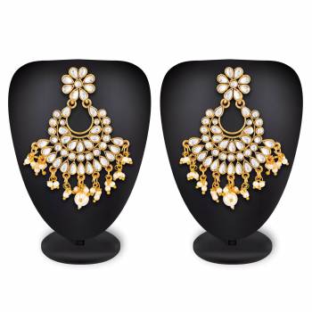 For Your Heavy Traditionals, Grab This Beautiful And Attractive Looking Earrings Set In Golden Color Beautified With Stone Work. This Can Also Be Paired With Any Colored Attire.