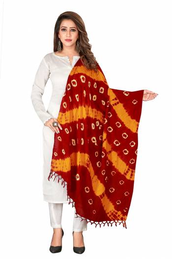 Here Is A Very Pretty Dupatta Perfect For Summers. This Pretty Dupatta Is Cotton Based Beautified With Bandhani Prints All Over It. Pait This Up With Any Same Or Contrasting Colored Kurti. 