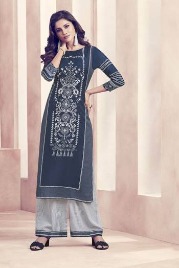 Enhance Your Personality Wearing This Designer Readymade Kurti And Plazzo In Navy Blue And White Color Respectively. This Set Is Fabricated On Rayon Beautified With Prints all Over Which Is Also Light Weight And Easy To Carry All Day Long. 