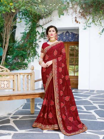 Look Beautiful Wearing This Designer Saree In Maroon Color Paired With Maroon Colored Blouse. This Saree Is Fabricated On Georgette Paired With Art Silk Fabricated Blouse. It Is Easy To Drape, Durable And Easy To Care For