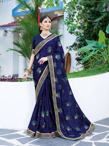 Celebrate This Festive Season Wearing This Designer Silk Based Saree In Royal Blue Color Paired With Royal Blue Colored Blouse. This Saree Is Fabricated On Georgette Paired With Art Silk Fabricated Blouse Beautified With Thread Embroidery And Stone Work