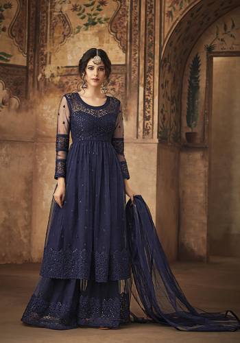 Get Ready For The Upcoming Festive And Wedding Season With This Designer Sharara Suit In Navy Blue Color Fabricated On Net. This Net Based Sharara Suit Is Beautified With Tone To Tone Embroidery Which Gives A Rich And Subtle Look. 