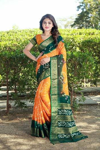 Beat This Heat This Summer With This Pretty Cotton Based Saree. This Saree And Blouse Are Fabricated On Art Cotton Beautified With Bandhani Prints All Over. It Is Light Weight And Easy To Carry All Day Long. 