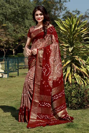 Beat This Heat This Summer With This Pretty Cotton Based Saree. This Saree And Blouse Are Fabricated On Art Cotton Beautified With Bandhani Prints All Over. It Is Light Weight And Easy To Carry All Day Long. 