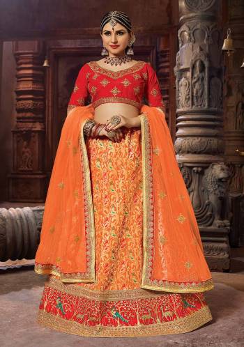 For A Proper Traditional Look, Grab This Designer Lehenga Choli In Red And Orange Color. Its Blouse Is Fabricated On Art Silk Paired With Banarasi Art Silk Lehenga And Net Fabricated Dupatta. 