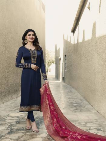 Grab This Beautiful Designer Straight Suit In Navy Blue Colored Top And Bottom Paired With Contrasting Dark Pink Colored Dupatta. Its Pretty Embroidered Top Is Fabricated On Satin Georgette Paired With Santoon Bottom And Banarasi Art Silk Dupatta. 