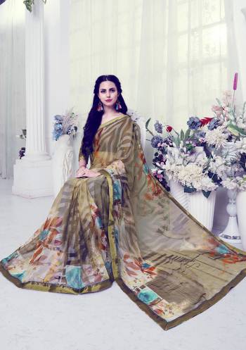 For Your Utmost Comfort, Grab This Pretty Light Weight Saree Fabricated On Georgette Brasso Paired With Art Silk Fabricated Blouse. It Is Beautified With Prints And Lace Border. 