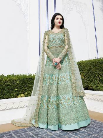 Grab This Beautiful And Heavy Designer Floor Length Suit In Sea Green Color Paired With Sea Green Colored Bottom And Dupatta. Its Heavy Embroidered Top And Dupatta Are Fabricated On Net Paired With Satin Bottom. 