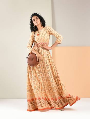 Simple And Elegant Looking Designer Readymade Gown Is Here In Beige Color Fabricated On Rayon. This Kurti Is Light Weight Soft Towards Skin And Available In All Regular Sizes.