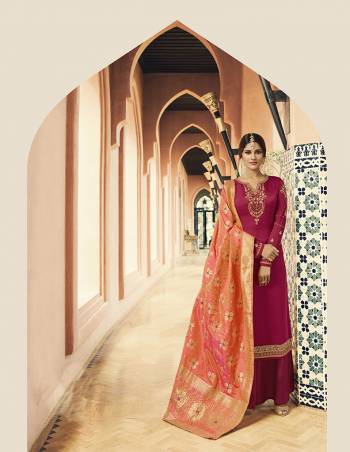 Bright And Visually Appealing Color Pallete Is Here With This Designer Straight Cut Suit In Dark Pink Color Paired With Contrasting Orange Colored Dupatta. Its Top Is Fabricated On Satin Georgette Paired With Santoon Bottom And Silk Based Dupatta. It Is Beautified With Attractive Embroidery Over The Top.