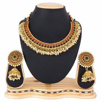 For A Queen Look, Here Is A Designer Royal Looking Necklace Set In Golden Color. This Necklace Set Can Be Paired With Heavy Ethnic Attire For More Enhanced Look. Buy Now