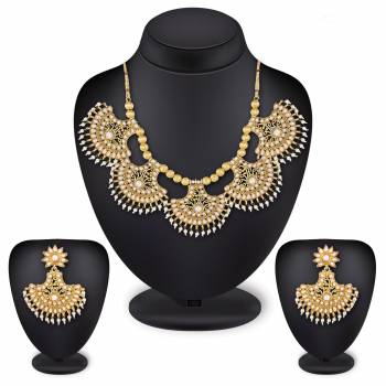 For A Queen Look, Here Is A Designer Royal Looking Necklace Set In Golden Color. This Necklace Set Can Be Paired With Heavy Ethnic Attire For More Enhanced Look. Buy Now