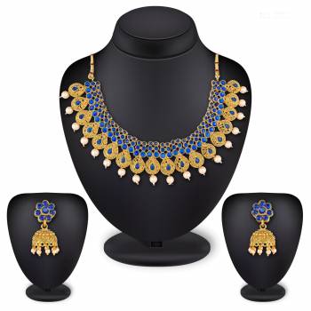 For A Queen Look, Here Is A Designer Royal Looking Necklace Set In Golden Color. This Necklace Set Can Be Paired With Heavy Ethnic Attire For More Enhanced Look. Buy Now