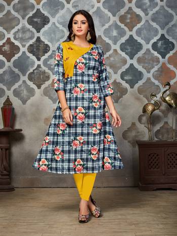 Grab This Beautiful Designer Readymade Kurti In Grey And Yellow Color. This Kurti Is Polyester Based Beautified With Checks And Floral Prints All Over. 