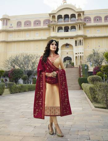 Evergreen Combination Is Here With This Designer Semi-Stitched Suit In Cream Colored Top And Bottom Paired With Maroon Colored Dupatta. Its Top Is Fabricated On Satin Georgette Paired With Santoon Bottom And Heavy Embroidered Georgette Fabricate Dupatta. 