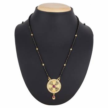 Here Is A Royal And Elegant Looking Magalsutra With A Pretty Delicate Chain And Heavy Golden Colored Pendant. This Mangalsutra Is Light In Weight And Can Be Paired With Any Colored Attire. Buy Now.