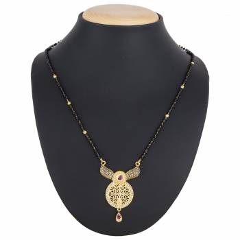 Here Is A Royal And Elegant Looking Magalsutra With A Pretty Delicate Chain And Heavy Golden Colored Pendant. This Mangalsutra Is Light In Weight And Can Be Paired With Any Colored Attire. Buy Now.