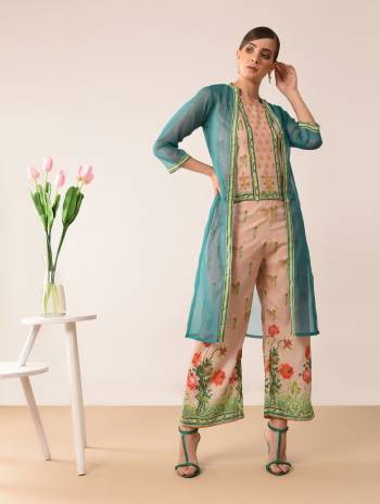 Here Is A Very Pretty Designer Indo-Western Three Piece Set. Its Top And Bottom Are In Beige Color Paired With Blue Colored Jacket. It Is Fabricated On Muslin Beautified With Prints All Over Paired With Orgenza Fabricated Jacket. Buy Now.