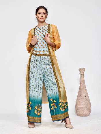 New And Unique Patterned Designer Indo-Western Pair Is Here In Sky Blue Colored Top And Bottom Paired With A Musturd Yellow Colored Jacket. This Pretty Readymade Pair Is Fabricated On Muslin Beautified With Prints Paired With A Jacket Fabricated On Orgenza. 